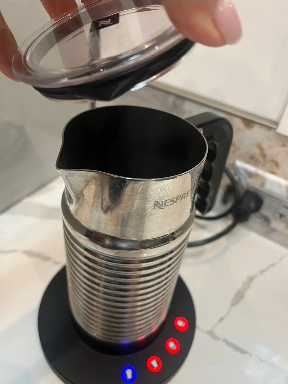 Nespresso Aeroccino 4 Milk Frother, a stainless steel electric milk frother